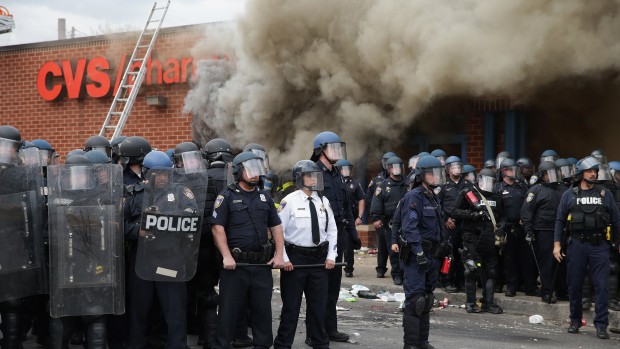 BALTIMORE%2C+MD+-+APRIL+27%3A+Baltimore+Police+form+a+parimeter+around+a+CVS+pharmacy+that+was+looted+and+burned+near+the+corner+of+Pennsylvania+and+North+avenues+during+violent+protests+following+the+funeral+of+Freddie+Gray+April+27%2C+2015+in+Baltimore%2C+Maryland.+Gray%2C+25%2C+who+was+arrested+for+possessing+a+switch+blade+knife+April+12+outside+the+Gilmor+Homes+housing+project+on+Baltimores+west+side.+According+to+his+attorney%2C+Gray+died+a+week+later+in+the+hospital+from+a+severe+spinal+cord+injury+he+received+while+in+police+custody.++%28Photo+by+Chip+Somodevilla%2FGetty+Images%29