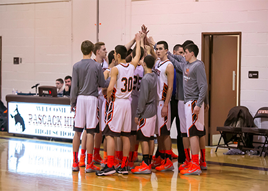 Boys Basketball Team breaking the huddle. Photo from Lors Photography