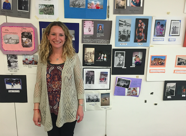 Lutz in front of projects made by her Literature of the Holocaust class.
