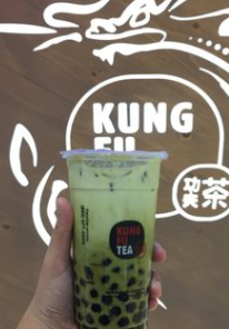 Green tea bubble tea slushie in front of the Kung Fu sign. Photo by Yelp.  