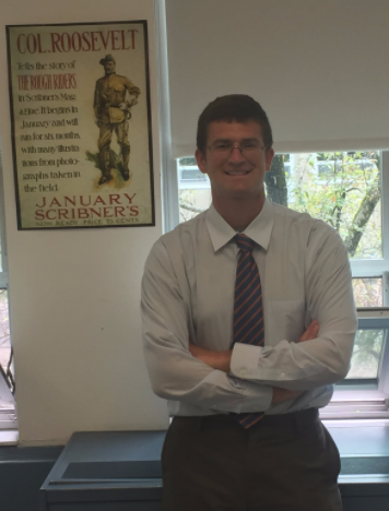 Nicholas Scerbo with a poster of Theodore Roosevelt. Photo by Matthew Wikfors.