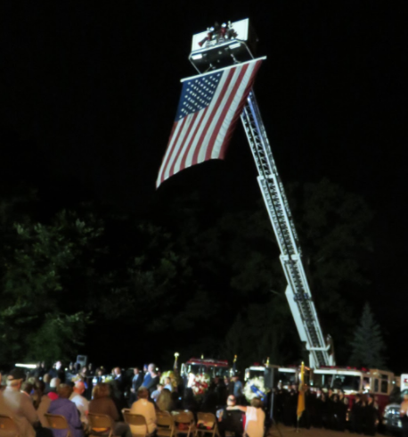 A flag hanging over the crowd at the service.
Photo by: Hanna Kimball