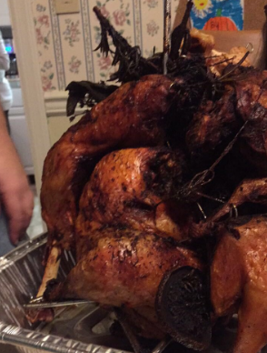 The full glory of a Turducken (a chicken inside of a duck that is then put in a turkey), which may be on the table of your Friendsgiving event. No those are not feathers, it’s rosemary. 