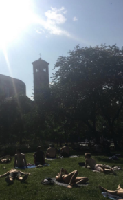 City-goers soaking up the sun at Central Park in New York City. Photo by Skylar Bachman.