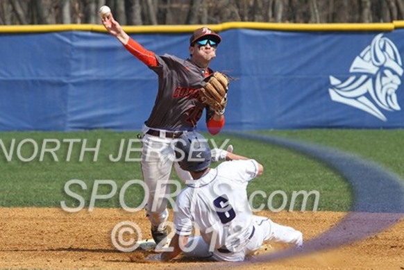 Bulzomi Turning a Double Play against Demarest. Photo Credits: northjerseysports.com