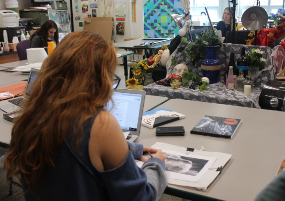 Junior Gillian Herzberger works hard on a project for AP Studio Art.