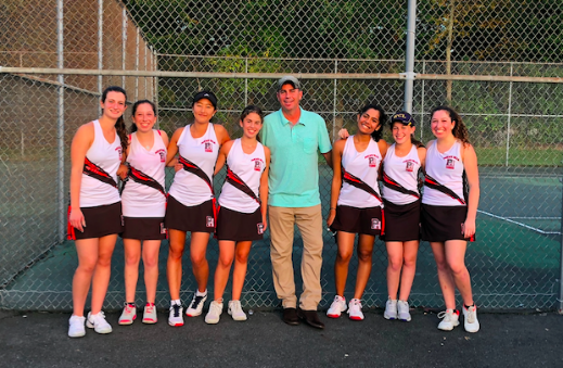 The Girls varsity tennis team poses after a win against Ramsey
