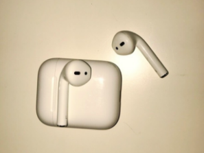 A pair of AirPods and their case