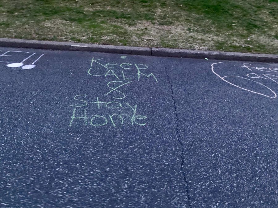 A chalk creation in Woodcliff Lake reminding residents to stay home. During quarantine, families have adjusted to the increased time spent together.