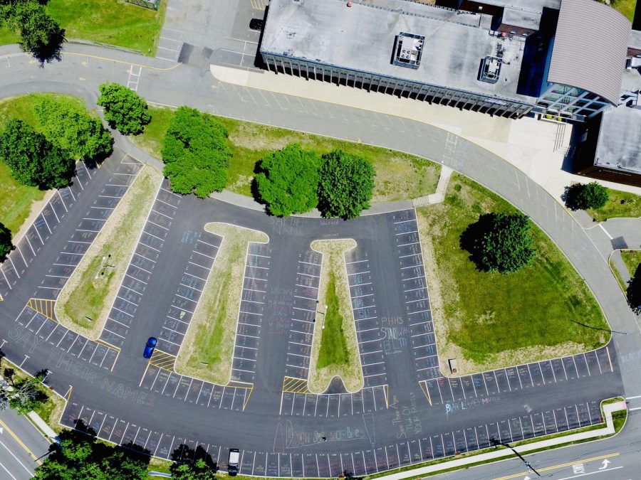 On Monday, students and faculty wrote the names of African Americans killed by police in Hills' parking lot. The protest against racial injustice was planned by the Hills-Valley equity team.