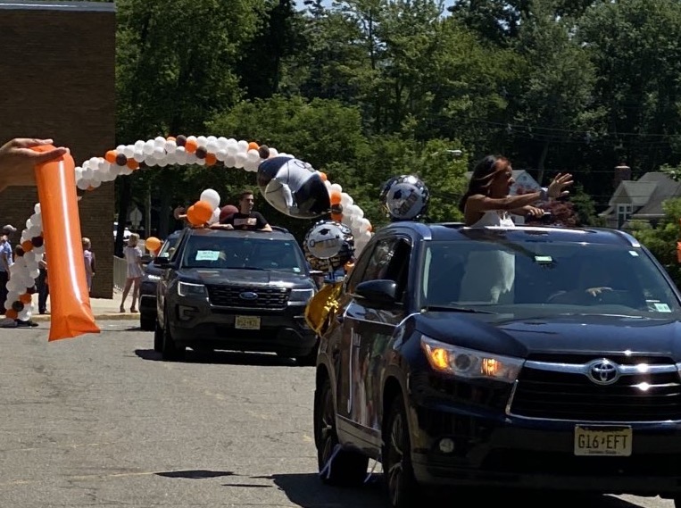 The+Class+of+2020+graduates+participates+in+a+drive-by+parade+through+Montvale+and+Hills+campus%2C+where+faculty+cheer+them+on.