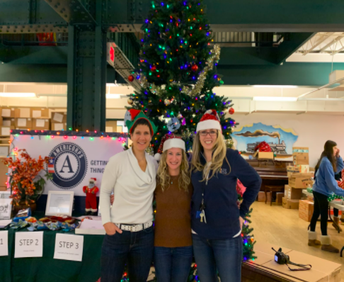 (From left to right): Mrs. Schwartzman, Lutz, and Mahaffey helping out at NJCDC last year.