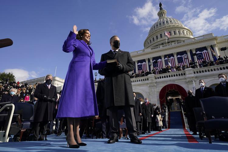 Vice President Kamala Harris, wearing purple, is sworn in at the 2021 presidential inauguration.