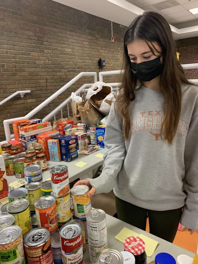 Hills junior Karya Acar sorting soup donations. 