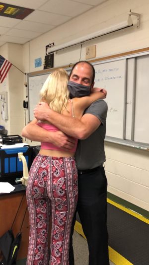 Soltman and his daughter hug after being presented Teacher of the Year.