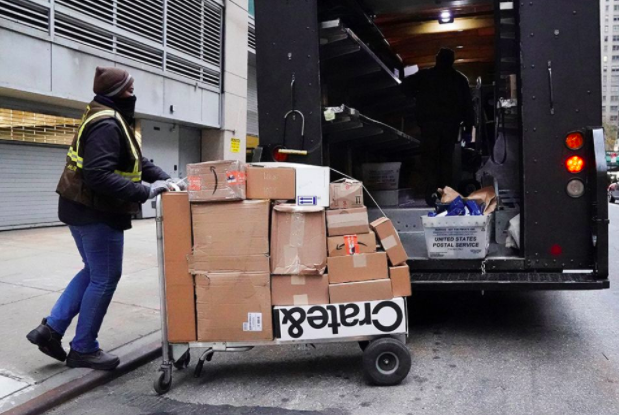 A UPS worker in New York City transports packages on Black Friday Nov. 26, 2021. (CNS/Reuters/Carlo Allegri)