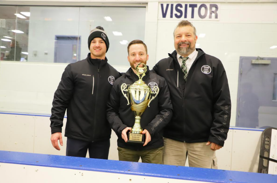 Cosgrove (middle) and his Big North Coach of the Year award. 