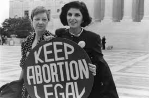 Norma McCorvey (left) and her lawyer in front of the Supreme Court steps.