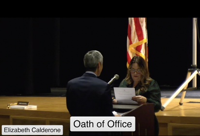 Calderone being sworn in by Usami.