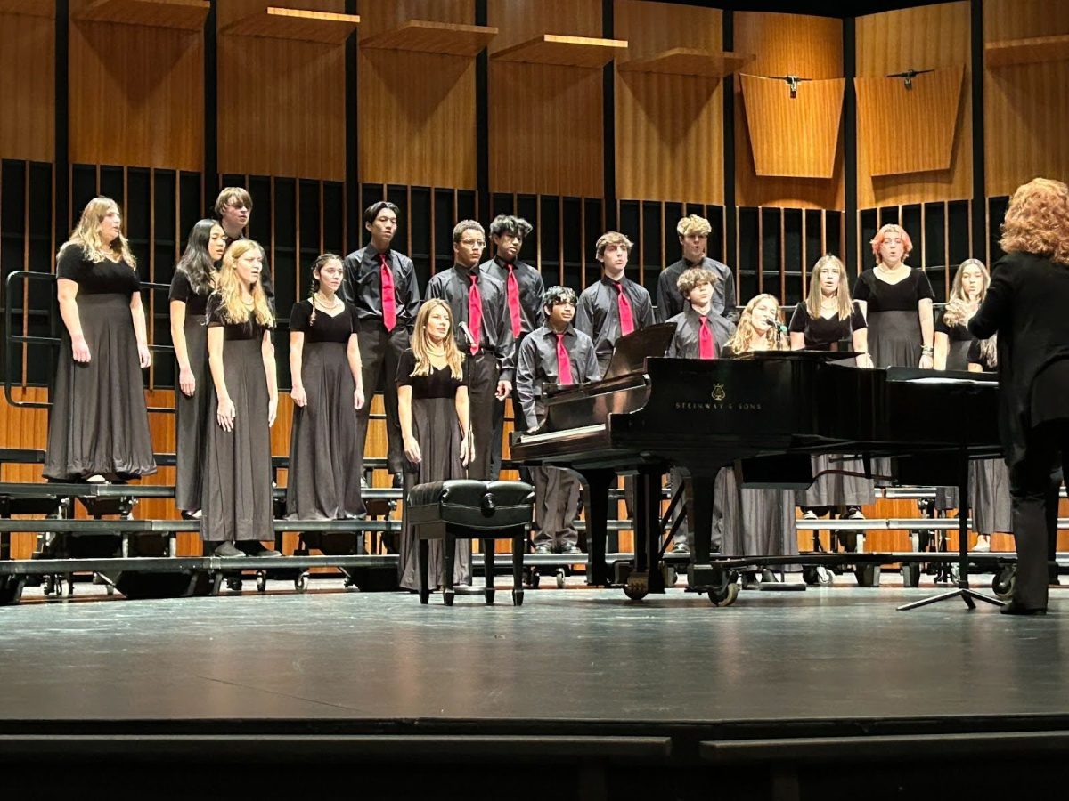 Hills Chamber Choir performing their repertoire in the Alexander Kasser Theater at Montclair State University (MSU).