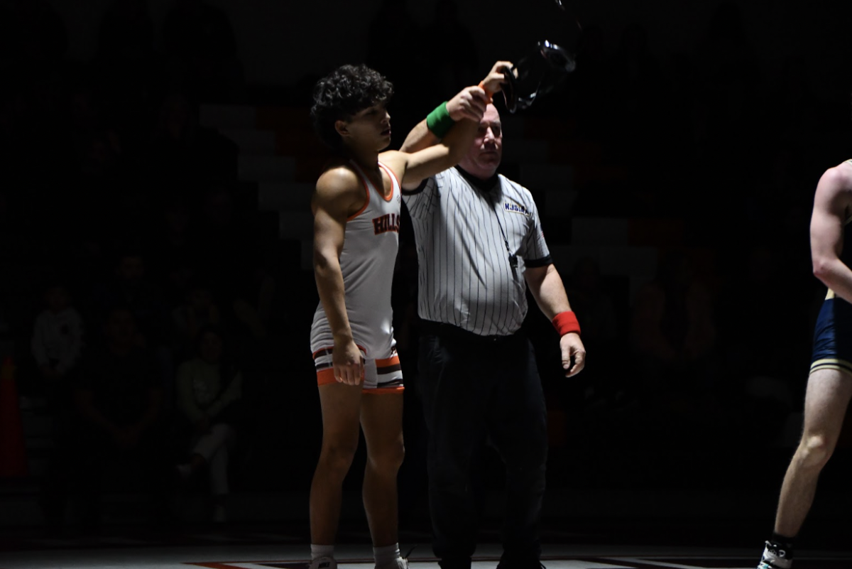 Mathew Velez celebrates a well-fought pin in the Broncos’ wrestling win.