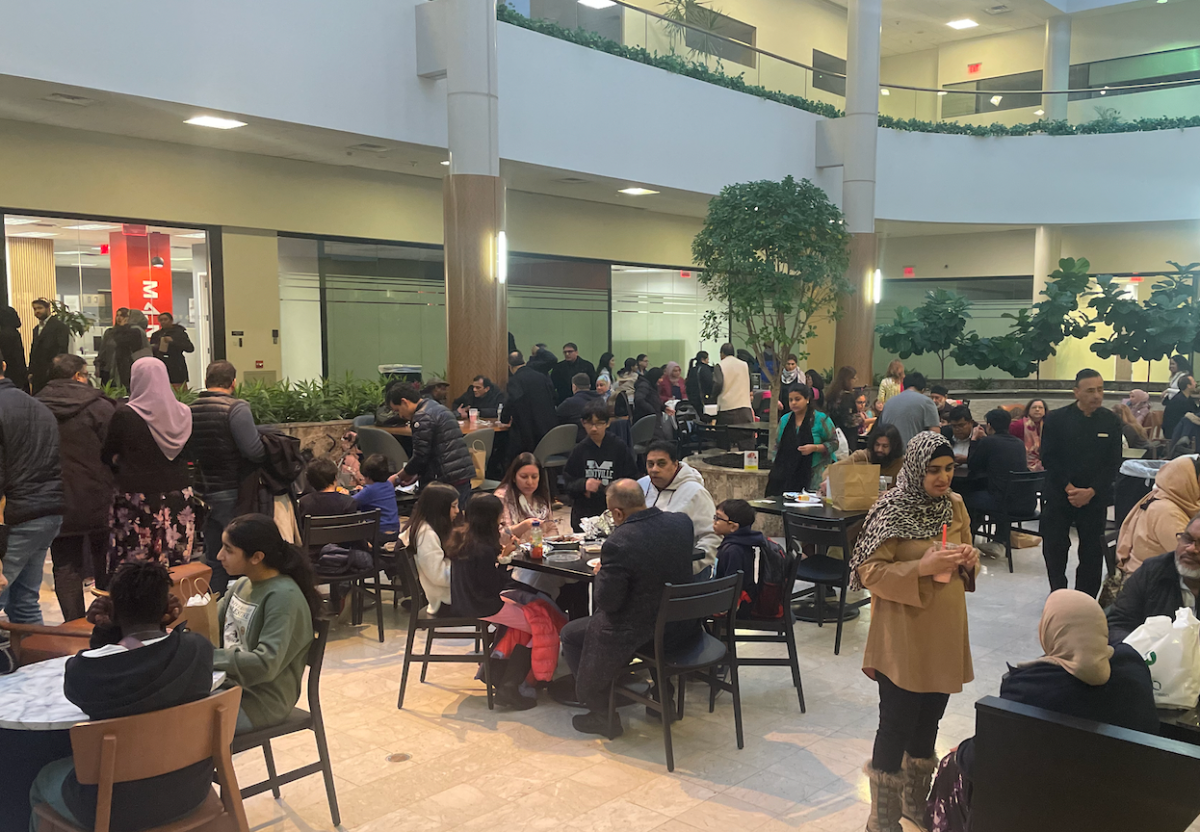Attendees enjoying food from different cultures at the event’s food court.