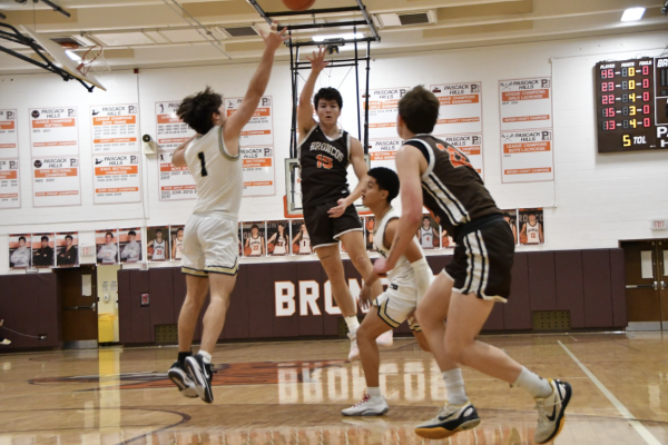 David Weidmuller passes to Nick Lukmann in the Broncos win over River Dell on Tuesday.