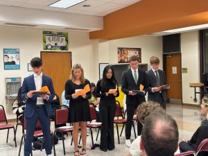 The inductees reciting the National Honor Society Pledge.