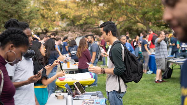 Students at a club fair. 