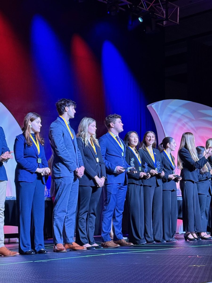 Hills students winning awards at the DECA ceremony. 